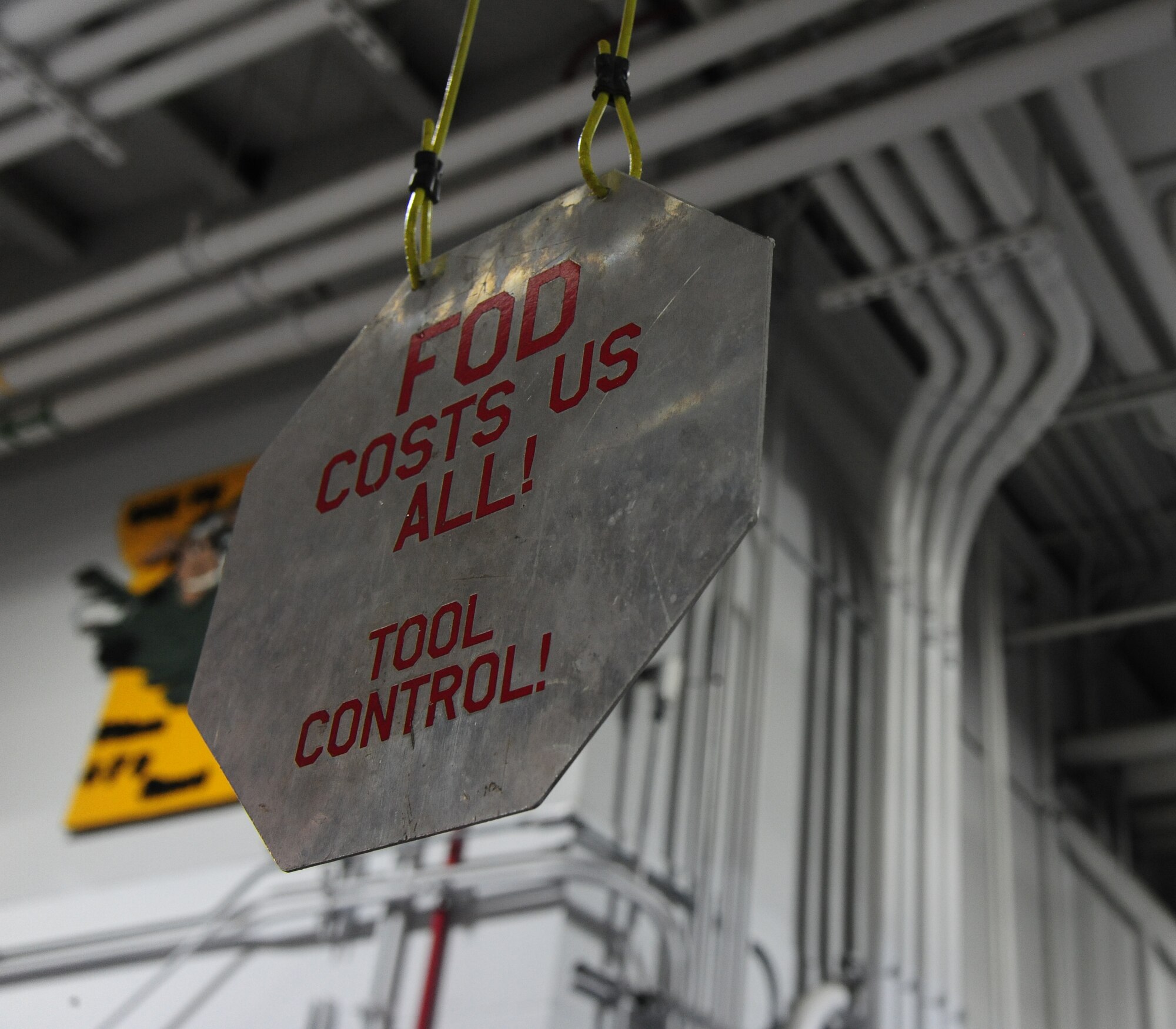 A sign hangs from the ceiling in the structural maintenance shop at Whiteman Air Force Base, Mo., Sept. 15, 2015. The structural maintenance shop prides themselves in ensuring quality work is performed at all times when handling aircraft parts. (U.S. Air Force photo by Senior Airman Keenan Berry/Released)




