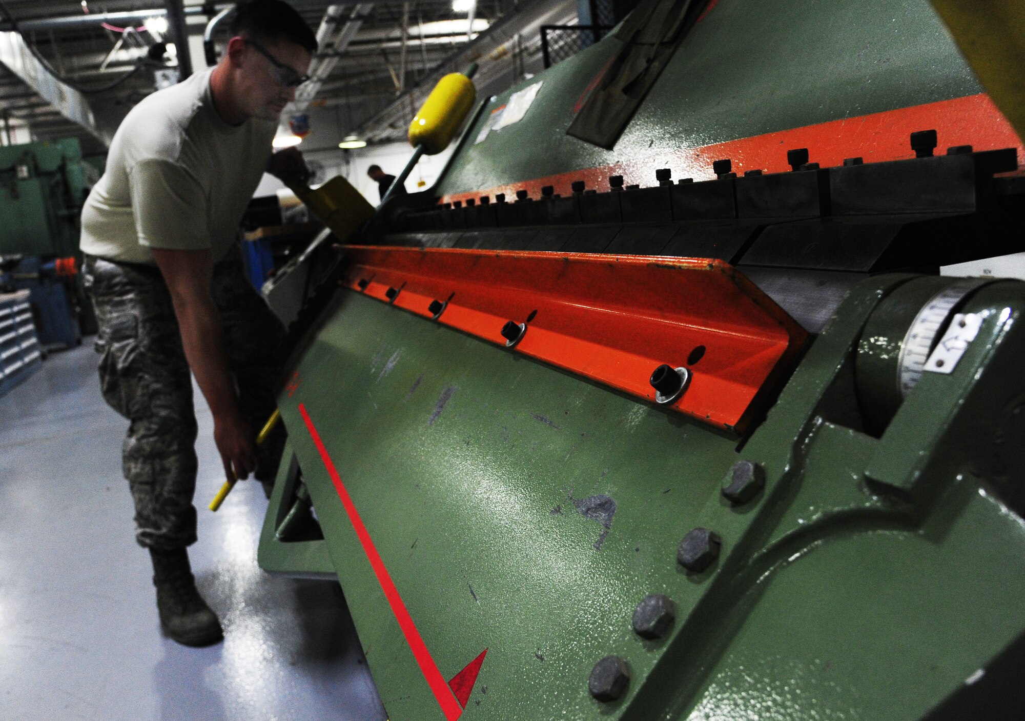 U.S. Air Force Senior Airman Cody Knott, 495th Fighter Group structural maintenance technician, bends a piece of metal at Whiteman Air Force Base, Mo., Sept. 15, 2015. Metal pieces are bent to fulfill the shape requirement for various aircraft parts. (U.S. Air Force photo by Senior Airman Keenan Berry/Released)


