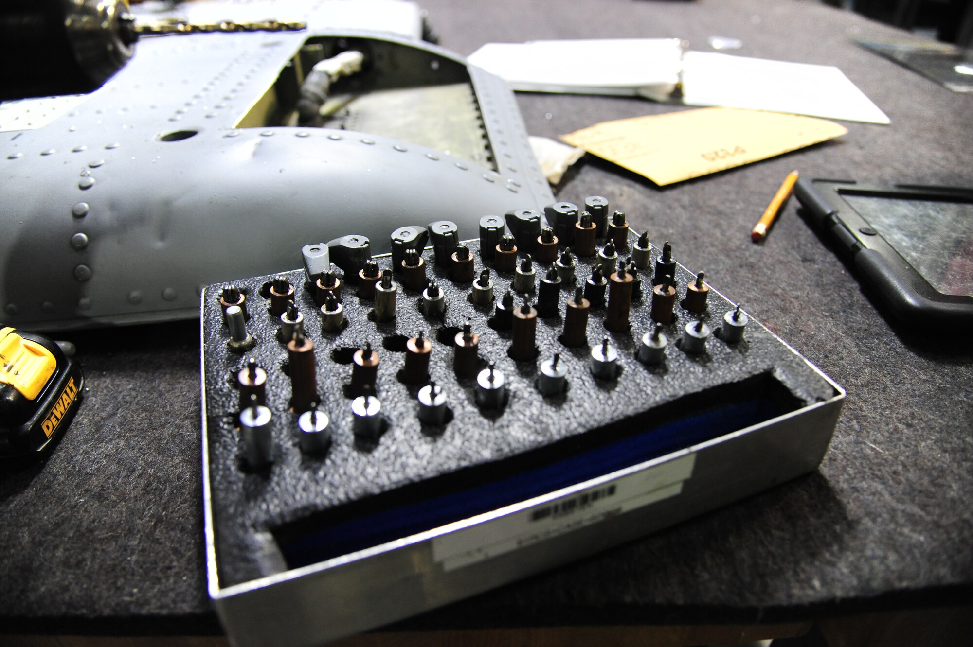 Tools lay dormant on a table at Whiteman Air Force Base, Mo., Sept. 15, 2015. These tools are used to hold aircraft parts together while maintenance is performed. (U.S. Air Force photo by Senior Airman Keenan Berry/Released)

