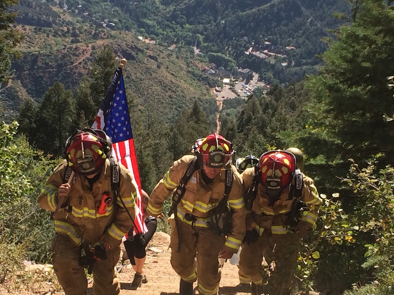 PETERSON AIR FORCE BASE, Colo. – Three firefighters from the 21st Civil Engineer Squadron hiked to the top of the Manitou Incline on Sept. 10, 2015. The firefighters climbed to the summit in full bunker gear on their off-duty time as a tribute and memorial to the first responders who perished in the terrorist attacks of 9/11. (U.S. Air Force photo by Tech. Sgt. Denise L. Flory)


