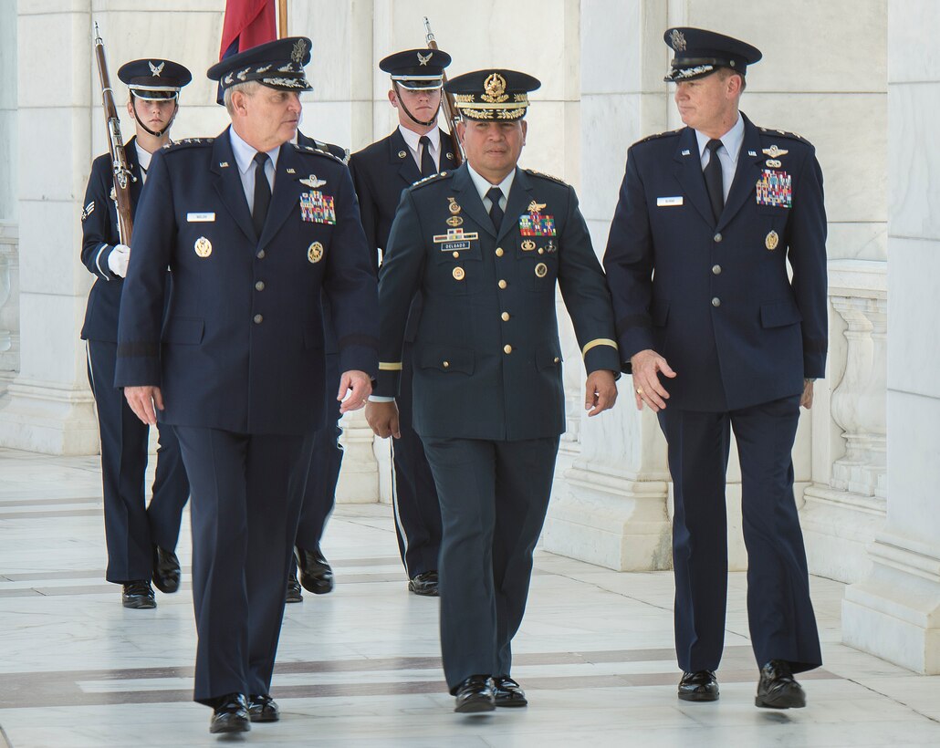 Air Force Chief of Staff Gen. Mark A. Welsh III, Philippine Air Force Commanding General Lt. Gen. Jeffrey Delgado and Air Force District of Washington Commander Maj. Gen. Darryl Burke talk before a wreath laying ceremony at the Tomb of the Unknown Soldier at Arlington National Cemetery Sept. 18, 2015. Delgado visited as part of the Pacific Air Chiefs’ Symposium, one of the Air Force's multilateral engagement opportunities used to build relationships with Pacific countries and to enhance theater security cooperation. The Air Force District of Washington brings air, space and cyberspace capabilities to the joint team protecting the nation's capital, and supports local personnel and those serving worldwide. (Photo/ Jim Varhegyi)