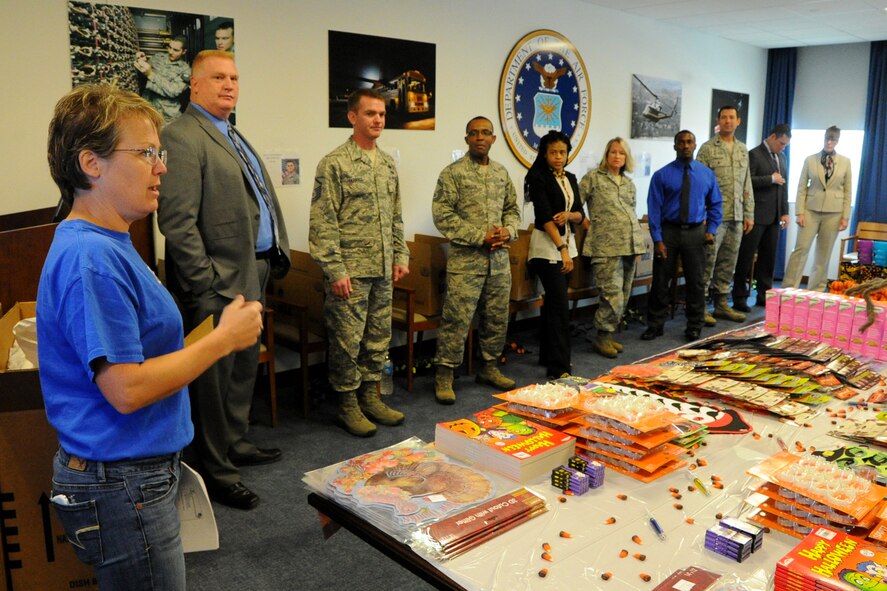Ms. Annette Bonaro, Air Force District of Washington unit deployment manager, outlines detailed packing procedures to the Air Force District of Washington volunteers who put together 18 care packages for AFDW deployed members September 21, 2015 on Joint Base Andrews, Md. The packages were filled with snacks and decorations to celebrate the Thanksgiving and Halloween holidays away from home. This was the 23rd shipment from AFDW’s Care Package Central since 2009. (U.S. Air Force photo/Staff Sgt. Matt Davis)