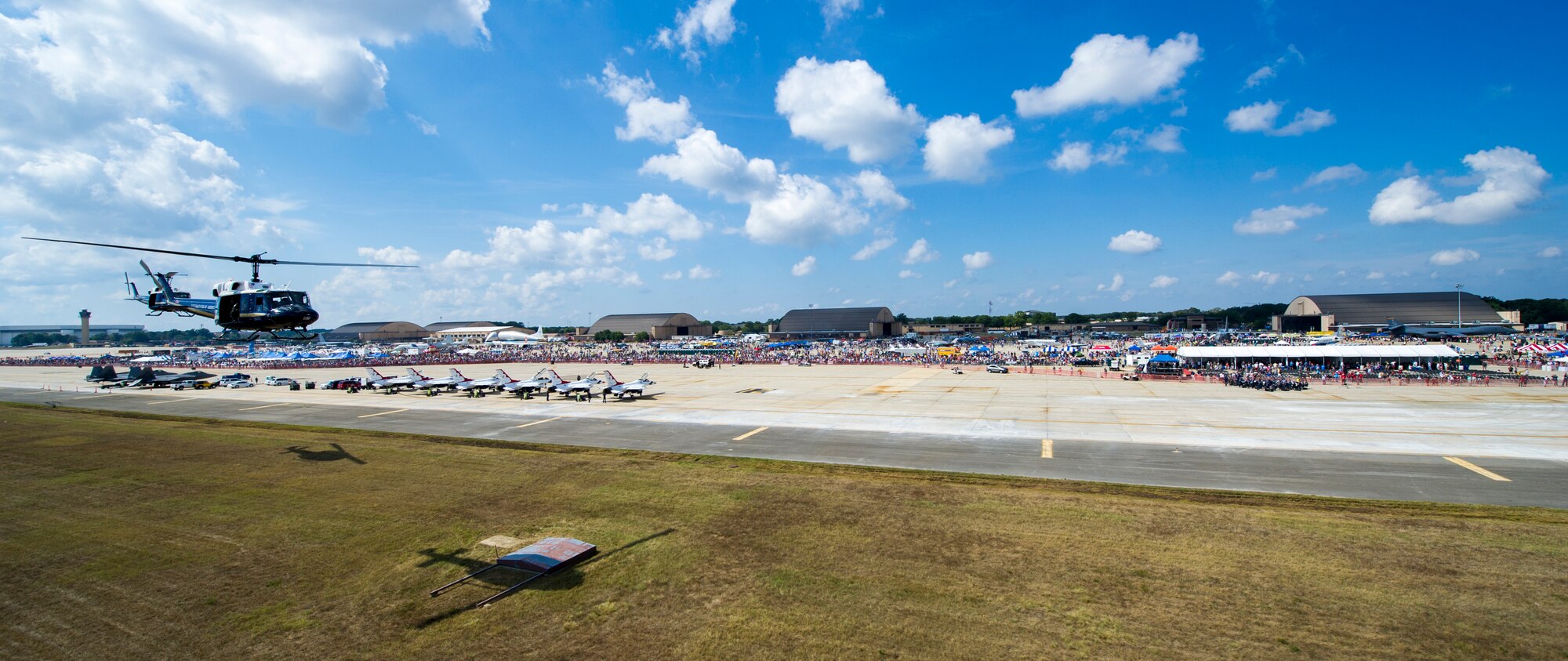 Members of the 1st Helicopter Squadron perform a fly-by during the 2015 Joint Base Andrews Air Show, Sept. 19. The aircraft flown were UH-1N Iroquois. (U.S. Air Force photo/Airman 1st Class Ryan J. Sonnier/Released)