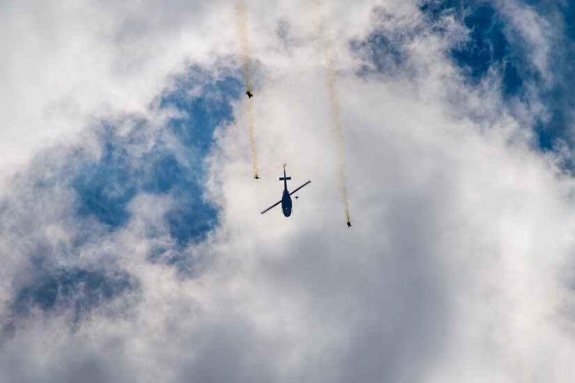 Members of the U.S. Special Operations Command Para-Commandos, jump from a UH-1N Iroquois during a performance for the 2015 Joint Base Andrews Air Show, Sept. 19. The team performs free-fall parachute demonstrations across the U.S. (U.S. Air Force photo/Airman 1st Class Ryan J. Sonnier/Released)