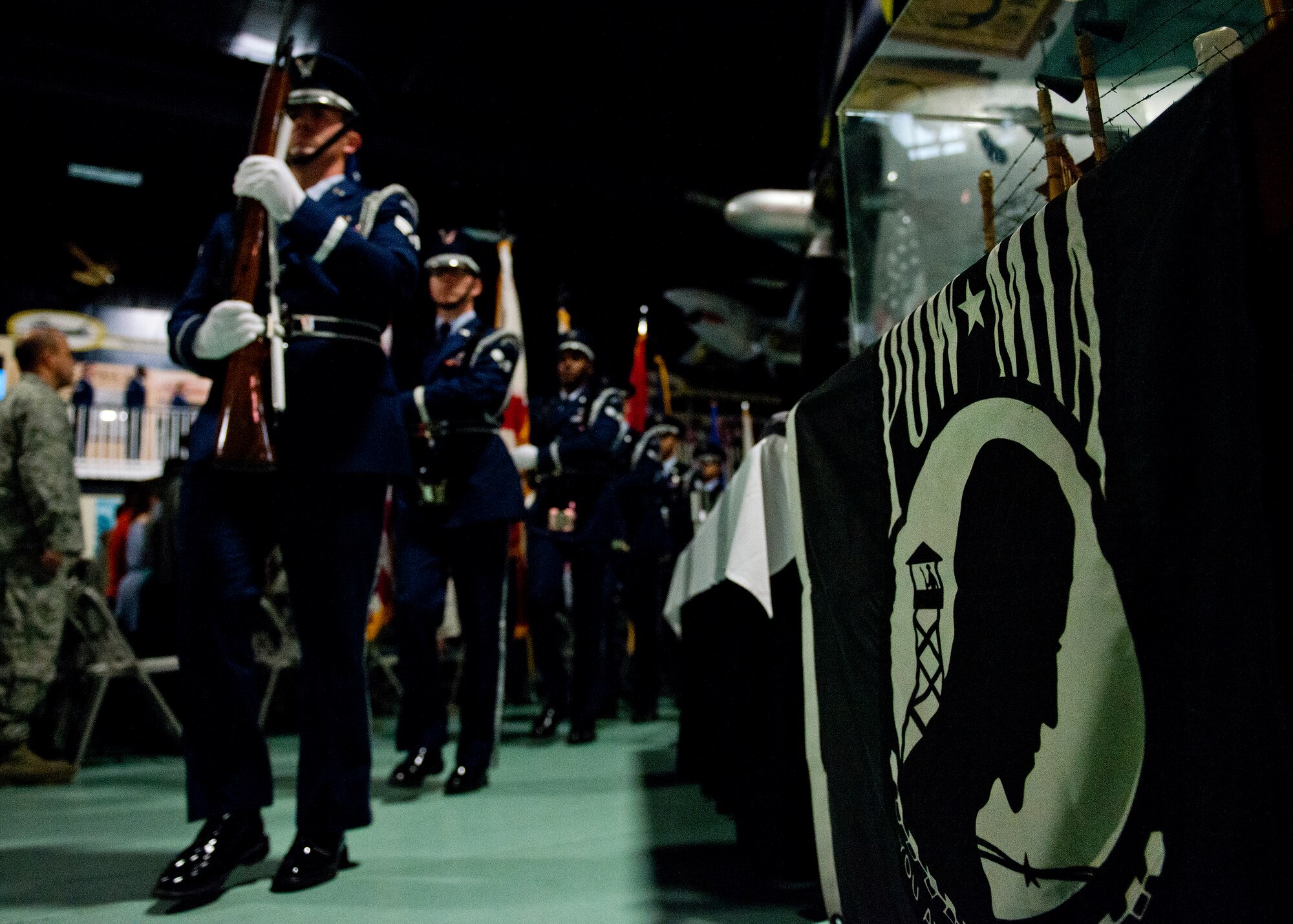 The Eglin Air Force Base honor guard march out after presenting the colors during the POW/MIA remembrance ceremony Sept. 18 at the Air Force Armament Museum.  The ceremony paid tribute to those military members who have yet to return home from defending America. The event featured tributes, guest speakers and honor guard procedures. (U.S. Air Force photo/Samuel King Jr.)