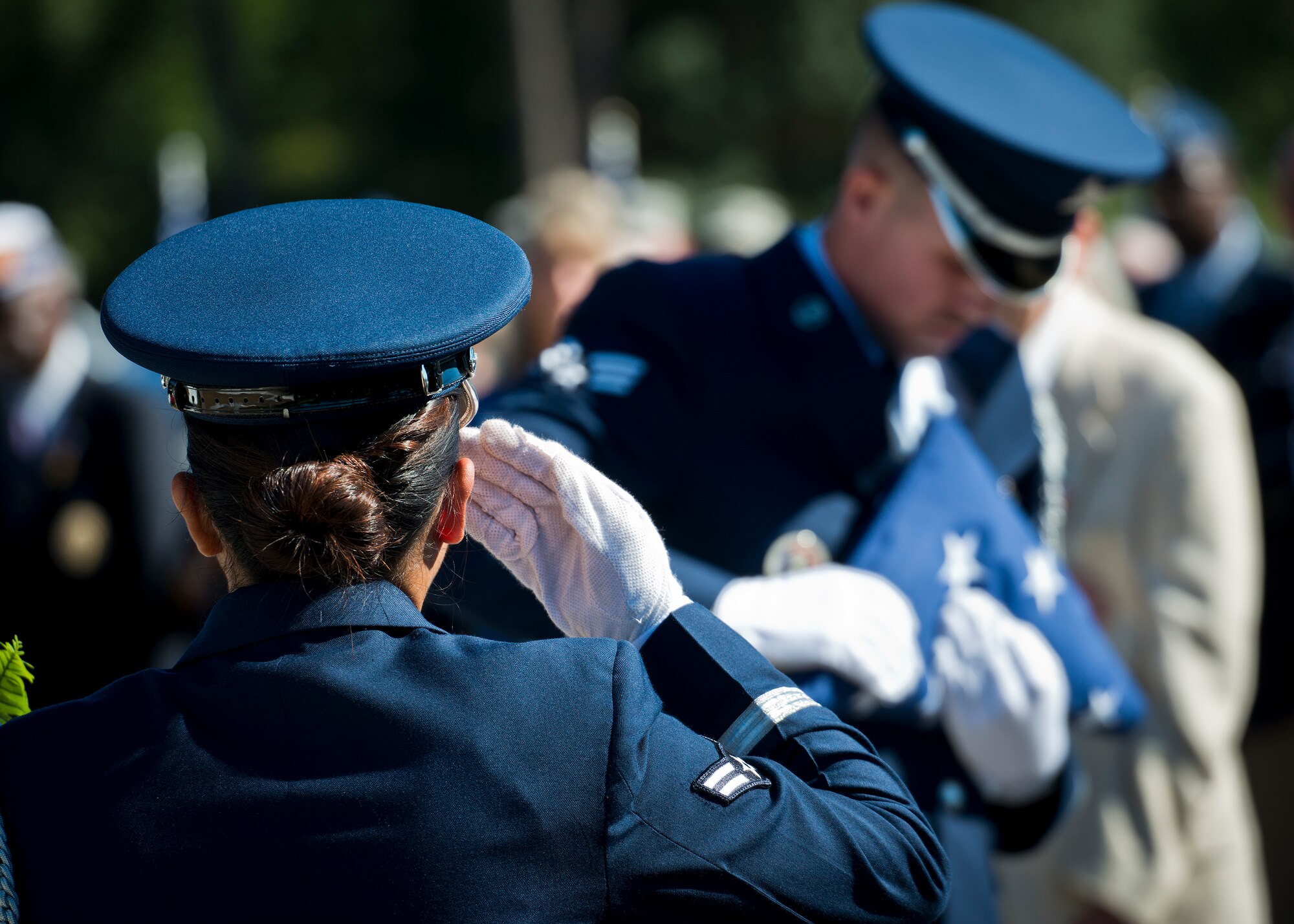 Senior Airman Brandon Pecsi, Eglin Air Force Base honor guard, performs a flag folding demonstration at the POW/MIA remembrance ceremony Sept. 18 at the Air Force Armament Museum.  The ceremony paid tribute to those military members who have yet to return home from defending America. The event featured tributes, guest speakers and honor guard procedures. (U.S. Air Force photo/Samuel King Jr.)