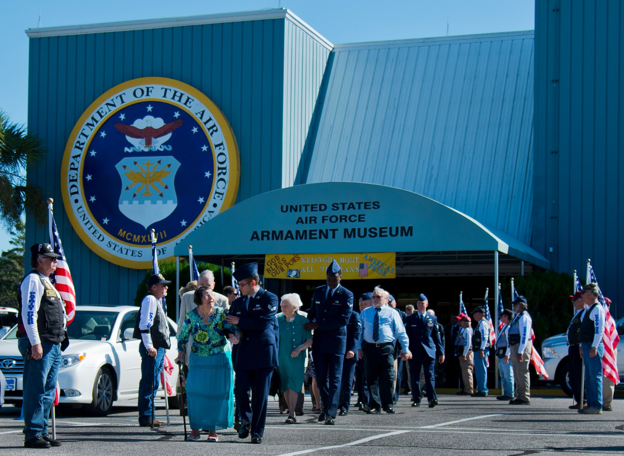 Airmen escort honored guests to the outdoor portion of the POW/MIA remembrance ceremony Sept. 18 at the Air Force Armament Museum.  The ceremony paid tribute to those military members who have yet to return home from defending America. The event featured tributes, guest speakers and honor guard procedures. (U.S. Air Force photo/Samuel King Jr.)