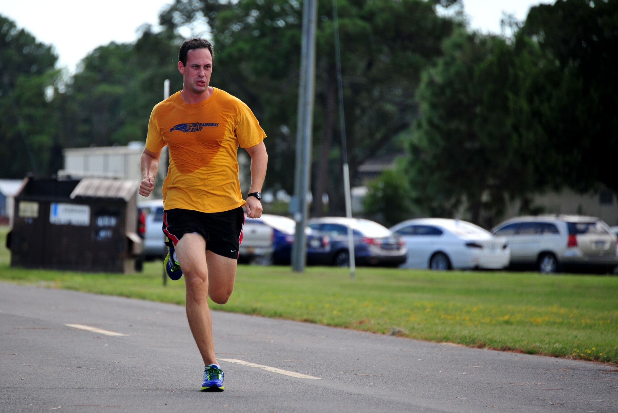 Capt. Rick “Screech” McDaniel, 36th Electronic Warfare Squadron, sprints toward the finish line during the Combined Federal Campaign Color Fun Run Sept. 17 at Eglin Air Force Base, Fla. McDaniel was the first runner and first male to complete the three-mile run at 19 minutes and 41 seconds. Medals were awarded for the first male, female and child runners. The run is the first of several events promoting the campaign now through Dec. 3. (U.S. Air Force Photo/Jasmine Porterfield)
