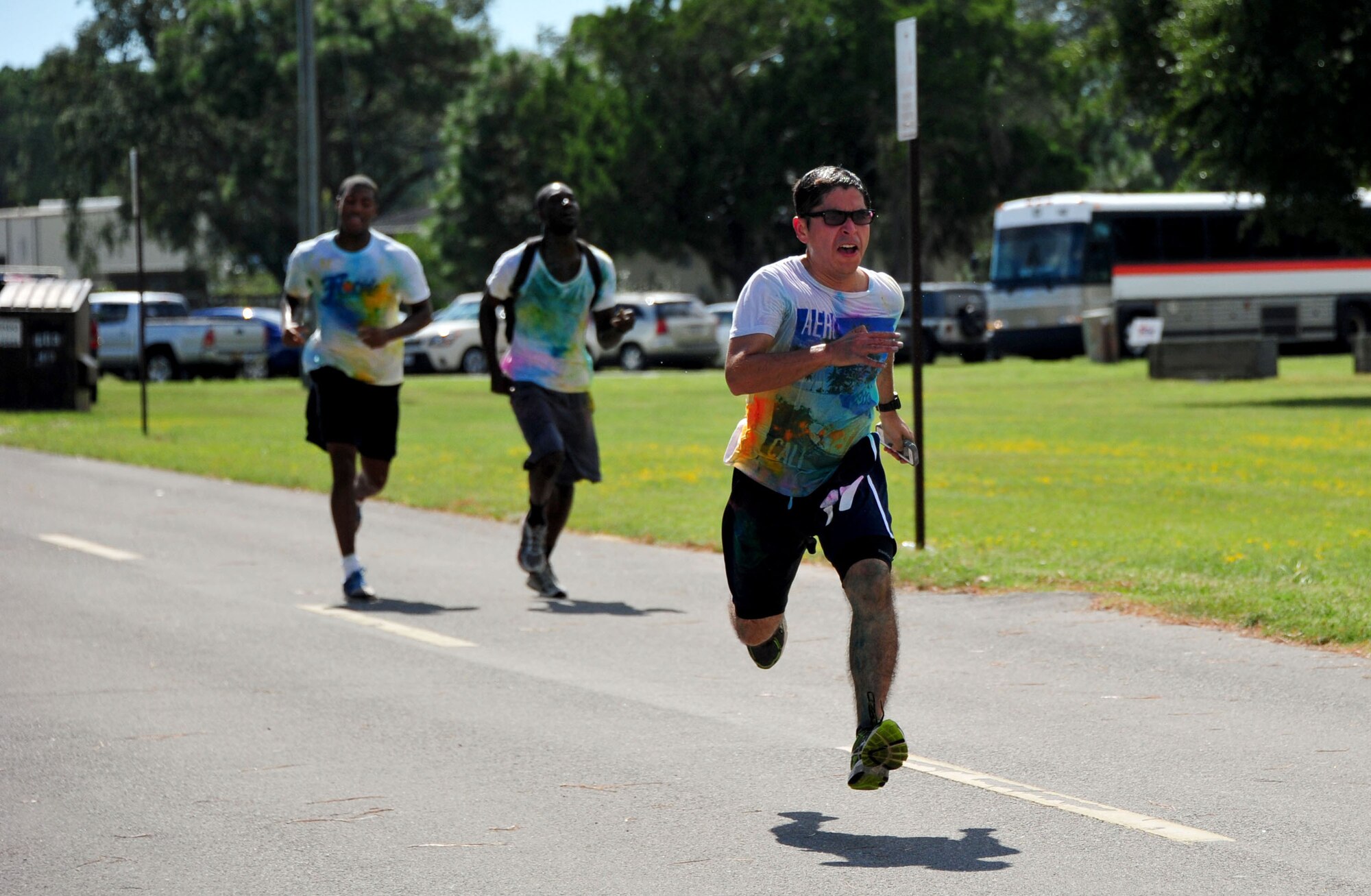 Runners sprint toward the finish line during the Combined Federal Campaign Color Fun Run Sept. 17 at Eglin Air Force Base, Fla. The three-mile run is the first of several events promoting the campaign now through Dec. 3. (U.S. Air Force Photo/Jasmine Porterfield)