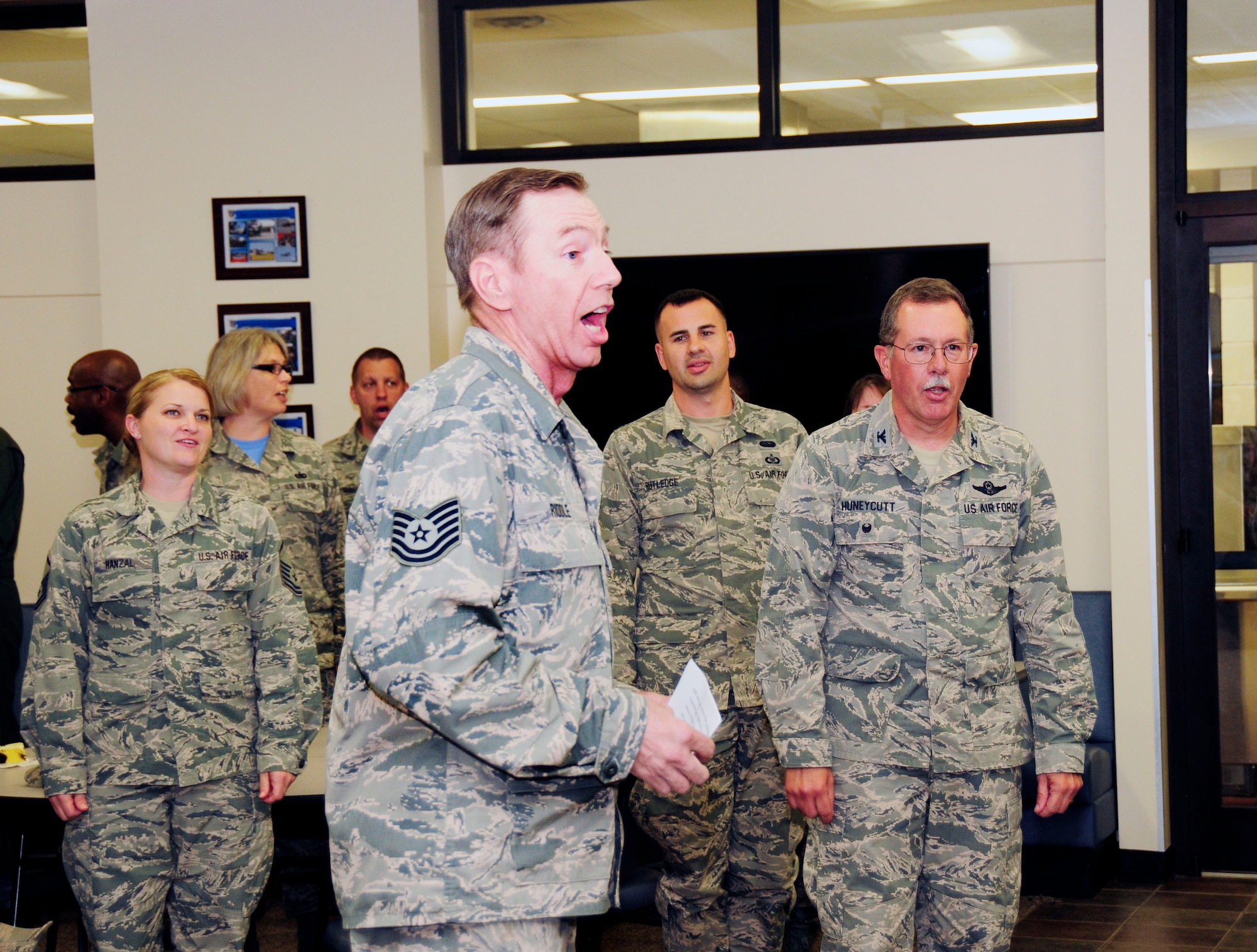 U.S. Air Force Tech. Sgt. Mark Riddle, 145th Maintenance Squadron, leads Airmen in a long standing military tradition of singing the official Air Force song, as members of the 145th Airlift Wing celebrate the 68th birthday of the United States Air Force during a ceremony held at the North Carolina Air National Guard Base, Charlotte Douglas International Airport, Sept. 18, 2015. (U.S. Air National Guard photo by Master Sgt. Patricia F. Moran, 145th Public Affairs/Released)