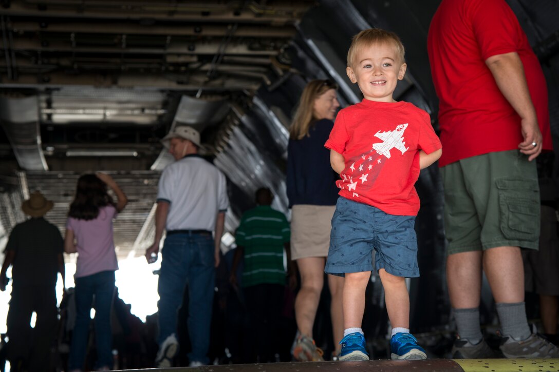 Logan Beckman, a 2-year-old air show attendee, stands inside the cabin of a C-5 Galaxy during the 2015 Joint Base Andrews Air Show, Sept. 19. The C-5 Galaxy was one of many static displays during the show. (U.S Air Force photo by Airman 1st Class Philip Bryant/Released)