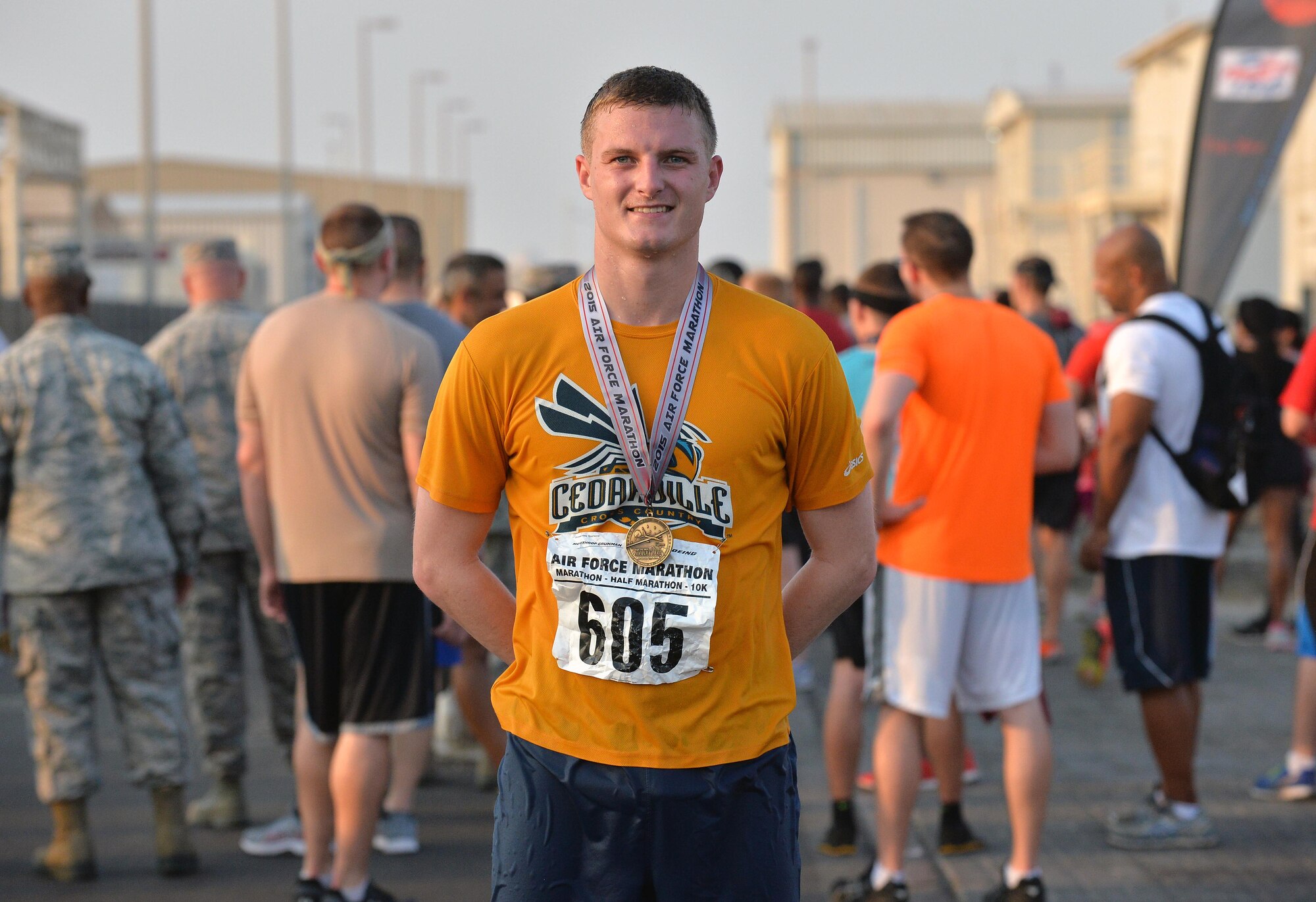 Capt. Hollis, 380th Expeditionary Operations Support Squadron airfield operations flight commander, stands at the finish line after being the first to complete the half marathon at undisclosed location in Southwest Asia Sept. 19, 2015. The run was held in light of the Air Force’s 68th birthday. (U.S. Air Force photo/Tech. Sgt. Jeff Andrejcik)