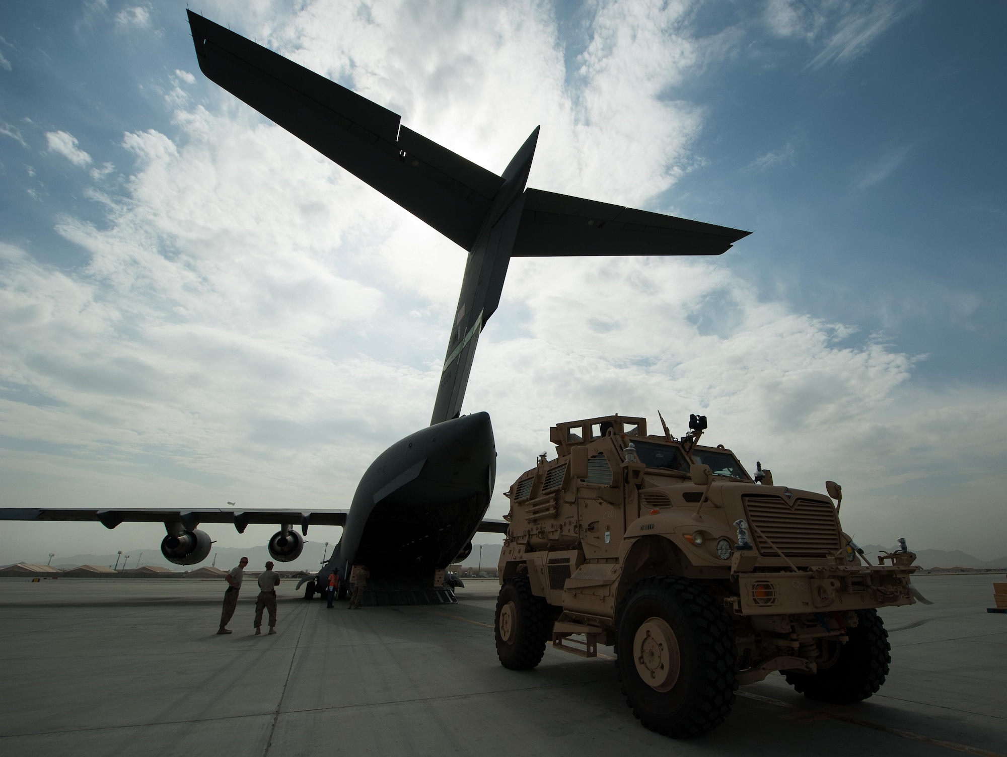 A U.S. Army Mine-Resistant Ambush Protected vehicle is offloaded from an Air Force C-17 Globemaster III aircraft at Bagram Airfield, Afghanistan, Sept. 21, 2015. USAF cargo aircraft have transported 31,500 short tons of cargo throughout Afghanistan this year (U.S. Air Force photo by Tech. Sgt. Joseph Swafford/Released)