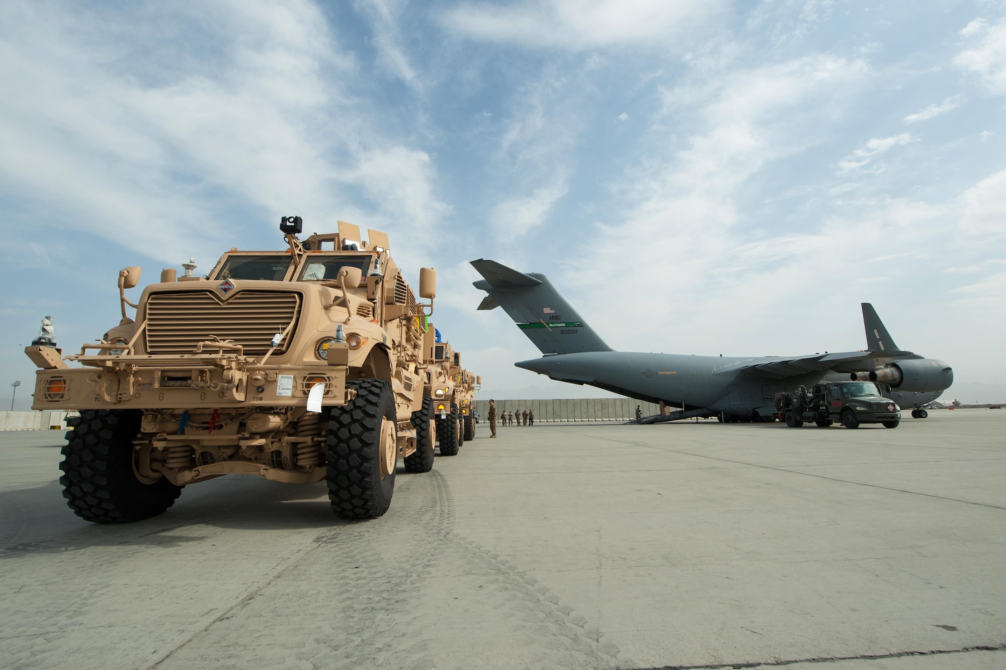 U.S. Army Mine-Resistant Ambush Protected vehicles are offloaded from an Air Force C-17 Globemaster III aircraft at Bagram Airfield, Afghanistan, Sept. 21, 2015. USAF cargo aircraft have transported 31,500 short tons of cargo throughout Afghanistan this year (U.S. Air Force photo by Tech. Sgt. Joseph Swafford/Released)