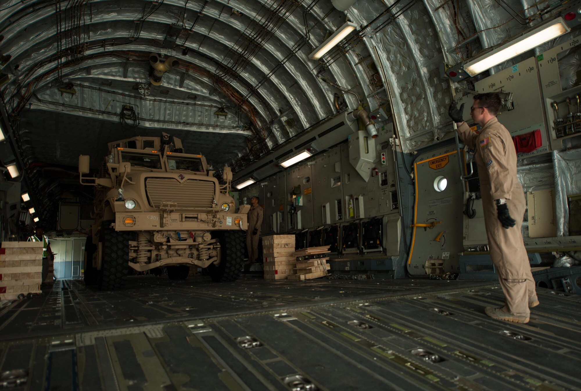 A U.S. Army Mine-Resistant Ambush Protected vehicle is offloaded from an Air Force C-17 Globemaster III aircraft at Bagram Airfield, Afghanistan, Sept. 21, 2015. USAF cargo aircraft have transported 31,500 short tons of cargo throughout Afghanistan this year (U.S. Air Force photo by Tech. Sgt. Joseph Swafford/Released)