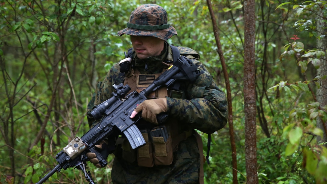 Lance Cpl. Edward Doyle, a rifleman with Charlie Company, 1st Battalion, 25th Marine Regiment, 4th Marine Division, Marine Forces Reserve, patrols through the woods during exercise Lake Effect at Evangola State Park, New York, Sept. 12, 2015. Each platoon in Charlie. Co. set up their own patrol bases and routes which occasionally lead to confrontation with the other platoons, adding an element of realism to the training.
