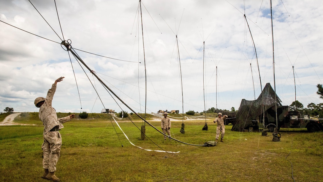 Marines with 10th Marine Regiment, 2nd Marine Division set up an antenna for communication during Operation Firestorm, an exercise to prepare the regiment for their upcoming exercise, Rolling Thunder, at Camp Lejeune, N.C., Aug. 16, 2015. The operation is a week-long field operation and is designed to ensure that communication and logistics capabilities are up to par before pushing out to Fort Bragg for Rolling Thunder.