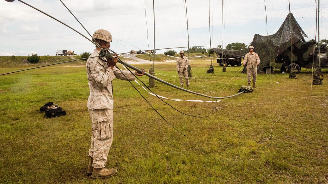 Marines with 10th Marine Regiment, 2nd Marine Division set up an antenna for communication during Operation Firestorm, an exercise to prepare the regiment for their upcoming exercise, Rolling Thunder, at Camp Lejeune, N.C., Aug. 16, 2015. The operation is a week-long field operation and is designed to ensure that communication and logistics capabilities are up to par before pushing out to Fort Bragg for Rolling Thunder. 