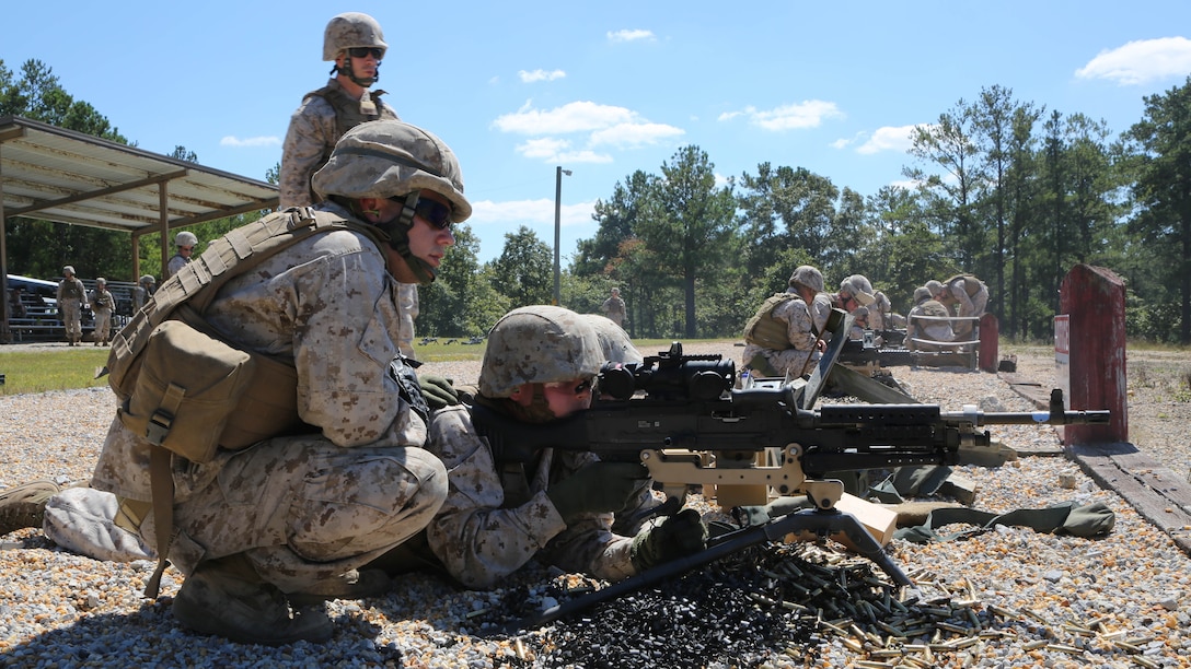 Marines from Battery M, 3rd Battalion, 14th Marine Regiment, 4th Marine Division, fire the M240 machine gun at targets down range at Pelham Range in Anniston, Ala., on Sept. 19, 2015. The Marines attended training to hone skills and increase their proficiency in crew-served weapons systems.