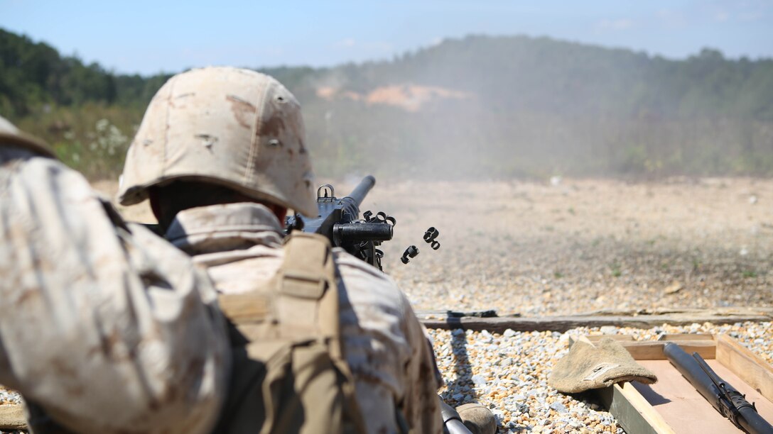 Marines from Battery M, 3rd Battalion, 14th Marine Regiment, 4th Marine Division fire the M250 machine gun at Pelham Range in Anniston, Ala., on Sept. 19, 2015. The Marines attended training to hone skills and increase their proficiency in crew-served weapons systems including the M249 SAW and M240.