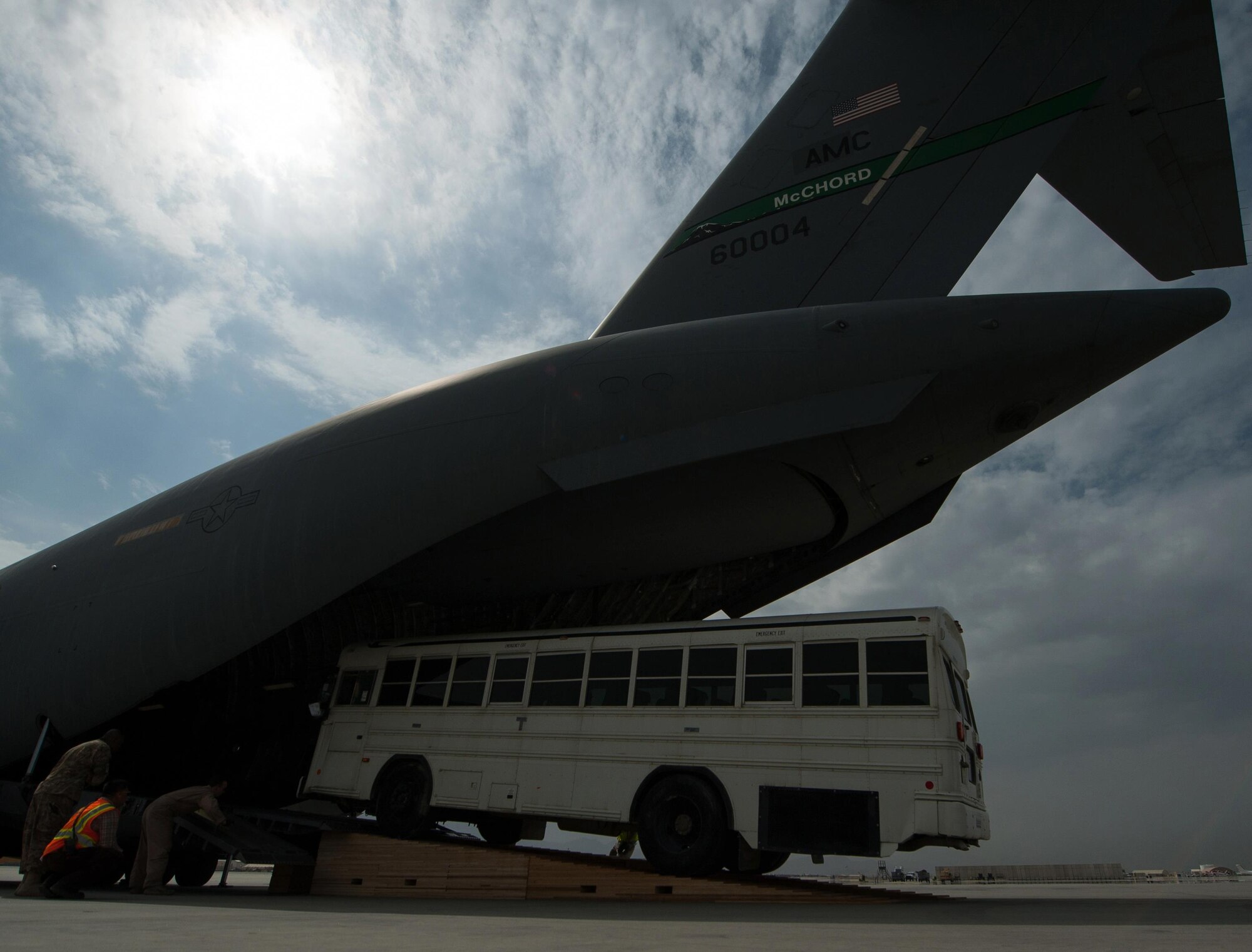 A bus is loaded onto an U.S. Air Force C-17 Globemaster III aircraft at Bagram Airfield, Afghanistan, Sept. 21, 2015. USAF cargo aircraft have transported 31,500 short tons of cargo throughout Afghanistan this year (U.S. Air Force photo by Tech. Sgt. Joseph Swafford/Released)