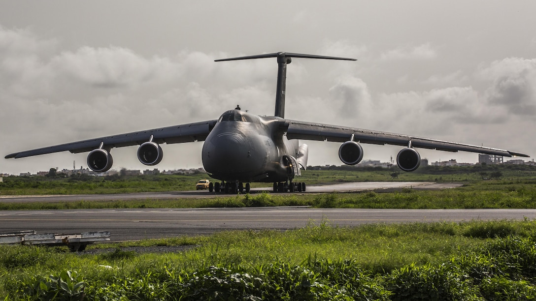 A U.S. Air Force C-5 Galaxy arrives to Dakar, Senegal with U.S. Marines and equipment from Special-Purpose Marine Air-Ground Task Force Crisis Response-Africa, based out of Morón, Spain, to establish a cooperative security location, or CSL, Sept. 14. The CSL allows SPMAGTF-CR-AF to temporarily locate forces in areas where they can quickly respond to developing crises.