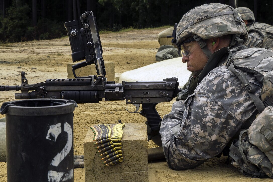 Capt. Dustin Duncan, a UH-60 Blackhawk trainer, waits to clear his weapon on the first day of  the U.S. Army Forces Command weapons marksmanship competition on Fort Bragg, N.C., Sept. 21, 2015. U.S. Army photo by Spc. L'Erin Wynn