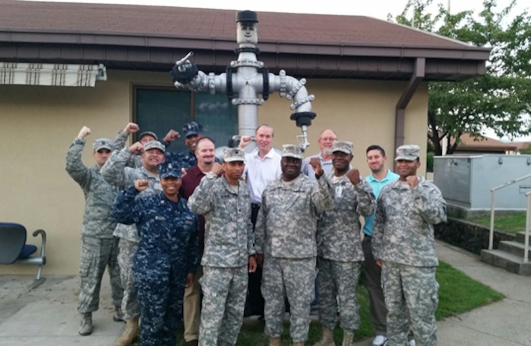 Group members supporting the Ulchi Freedom Guardian 2015 exercise pose outside of the Defense Logistics Agency Energy Pacific at Korea headquarters at the conclusion of their fuel and training coordination at Camp Walker, Daegu, South Korea, Aug. 28.