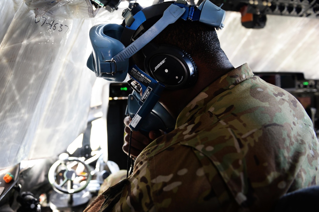 U.S. Air Force Capt. Boston McClain III tests his oxygen mask while getting ready for takeoff on Bagram Airfield, Afghanistan, Sept. 4, 2015. McClain III is a pilot assigned to the 774th Expeditionary Airlift Squadron. U.S. Air Force photo by Senior Airman Cierra Presentado