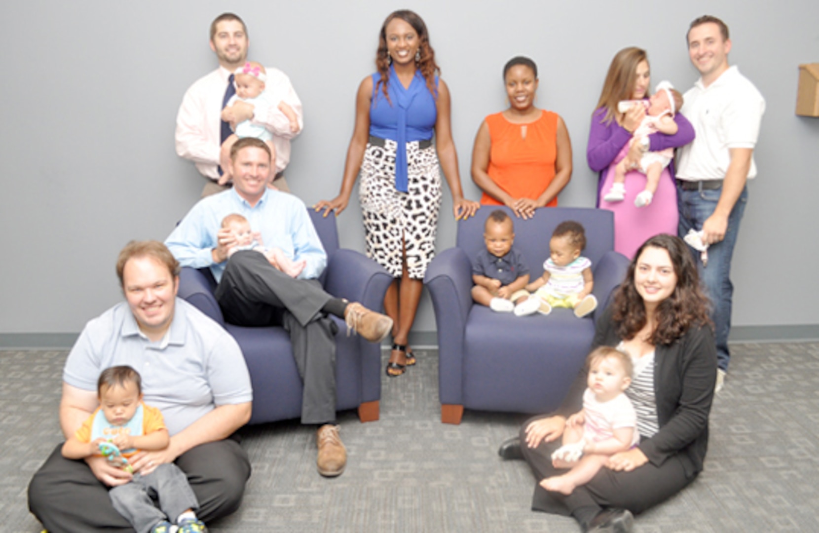 DLA Energy Utility Services’ newly appointed parents cradle their infants, representing the seven of 11 births in the last year.