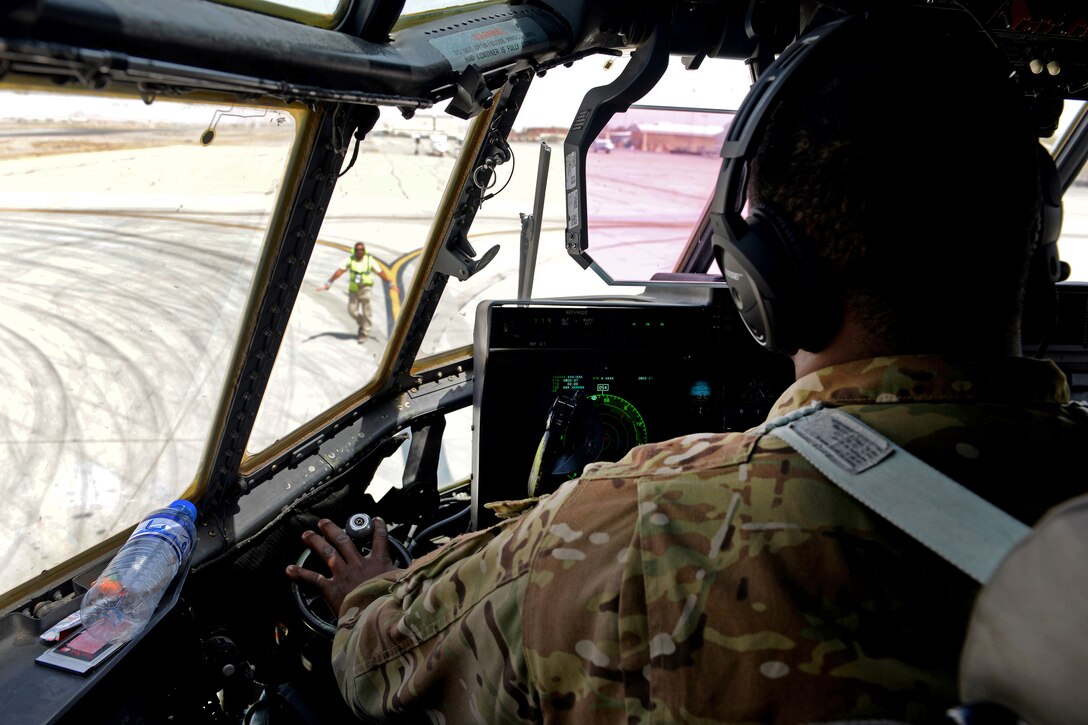 U.S. Air Force Capt. Boston McClain III taxis into a parking spot after arriving on Kandahar Airfield, Afghanistan, Sept. 4, 2015. McClain III is a pilot assigned to the 774th Expeditionary Airlift Squadron. U.S. Air Force photo by Senior Airman Cierra Presentado