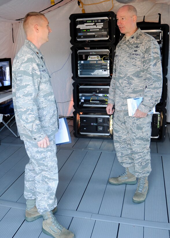 Col. Michael Boutet, right, the individual mobilization augmentee to A6 (Communications), Headquarters Air Force Reserve Command, Robbins AFB, Ga., receives a brief on the Joint Incident Site Communication Capability from Maj. Daniel Moline, commander, 302nd Communications Flight, during the September 2015 unit training assembly here. The JISCC is a full-spectrum communication system capable of providing a number of communication options to a variety of users, including wired and wireless internet connectivity, uplink to various satellites for users, telephone service to anywhere in the world, radio connections for HF, UHF and VHF and many more communications capabilities. (U.S. Air Force photo/Staff Sgt. Nathan Federico)