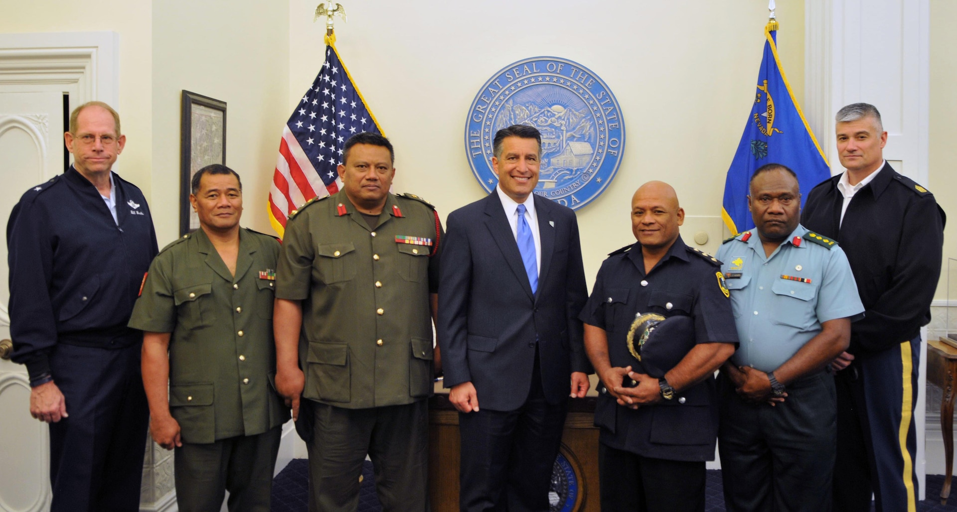 Chief military officials of the Kingdom of Tonga — Nevada’s nation partner under the National Guard Bureau’s State Partnership Program — and senior officials from Papua New Guinea and Nauru visited Nevada this week. From left to right: Nevada Adjutant General, Brig. Gen. Bill Burks; Warrant Officer Class One (WO1) Taulaki Falesiva; Brigadier Tupou T. Aleamotu’a; Nevada Gov. Brian Sandoval; Nauru Deputy Police Commissioner Antonius Amwano; Papua New Guinea Esekia Litur Wenzel; Nevada Army Guard Command Sgt. Maj. Jared Kopacki.