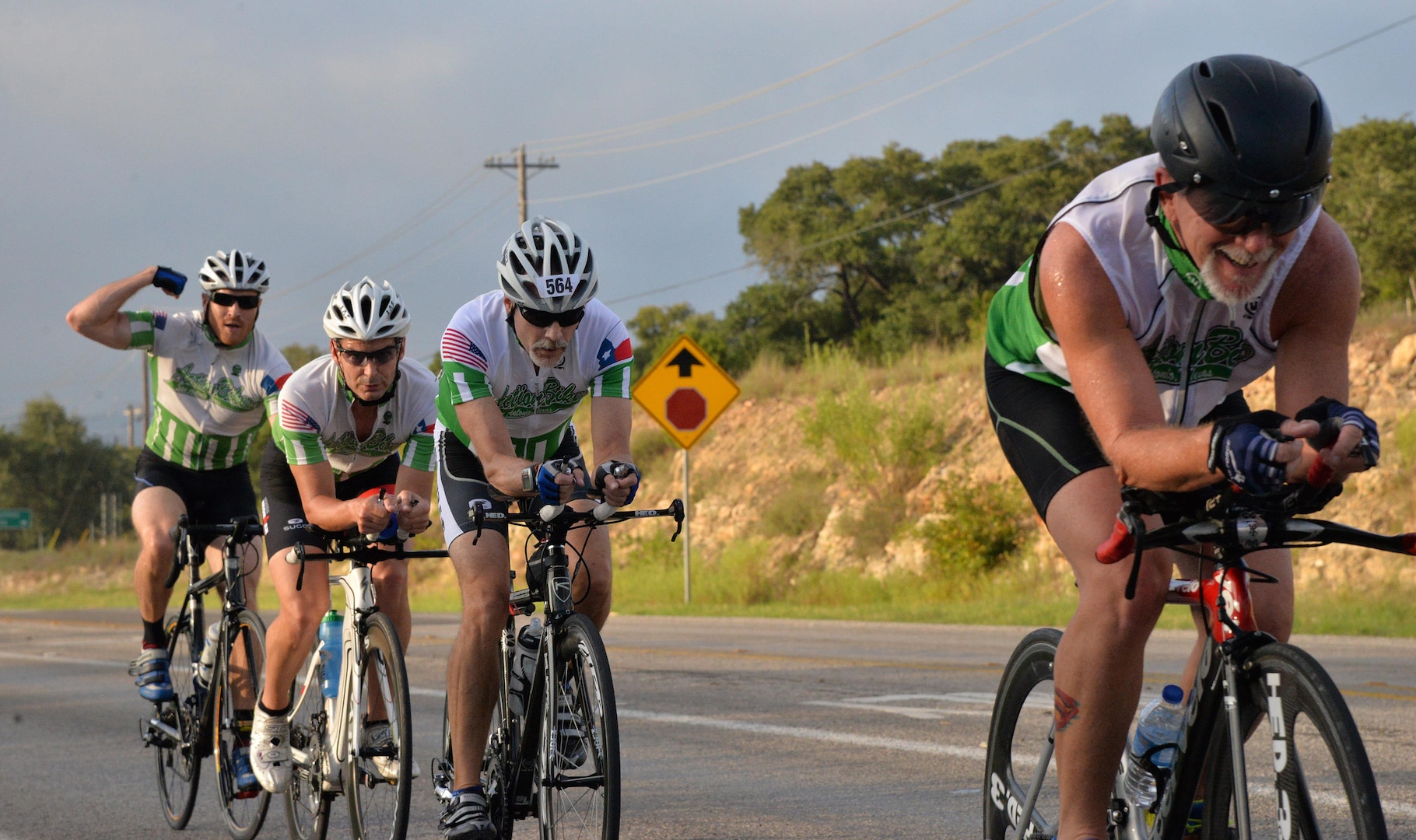Competitors ride toward the next transition point during the 22-mile bike race portion of the annual Rambler 120 competition Sept. 19, 2015 at Joint Base San Antonio Recreation Park at Canyon Lake. The Rambler 120, which is hosted by the 502nd Force Support Squadron, features four- and eight-person teams that engage in a friendly, but hard-fought, competition that challenges participants with a 22-mile bike race, 6-mile run, 2-mile raft race and a mystery event. (U.S. Air Force photo by Your Olivia Mendoza)