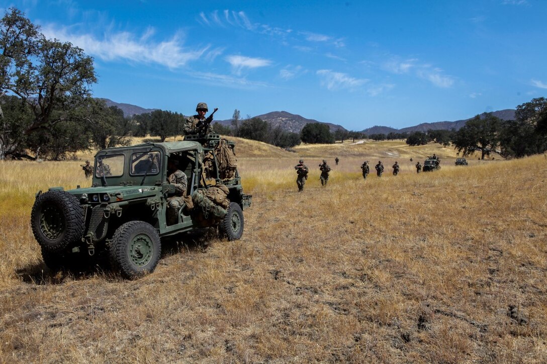 Marines with Company B, 1st Battalion, 1st Marine Regiment, 1st Marine Division, conduct a patrol at Fort Hunter Liggett, Calif., Aug. 25, 2015. The patrol was conducted as part of an experimental exercise designed to test Internally Transported Vehicle (ITVs) capabilities and discuss areas for improvement. The Marine Corps Warfighting Lab established the exercise to aid in the process of getting reliable information for future vehicle designs. (U.S. Marine Corps photo by Cpl. Joshua Murray)