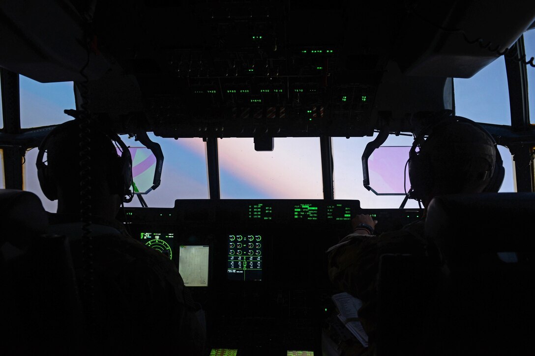 U.S. Air Force Capt.’s Boston McClain and Matt Buchholtz fly in their C-130J Super Hercules aircraft over Qatar, Sept. 4 2015, to 
Bagram Airfield, Afghanistan. McClain and Buchholtz are pilots assigned to the 774th Expeditionary Airlift Squadron. U.S. Air Force photo by Senior Airman Cierra Presentado
