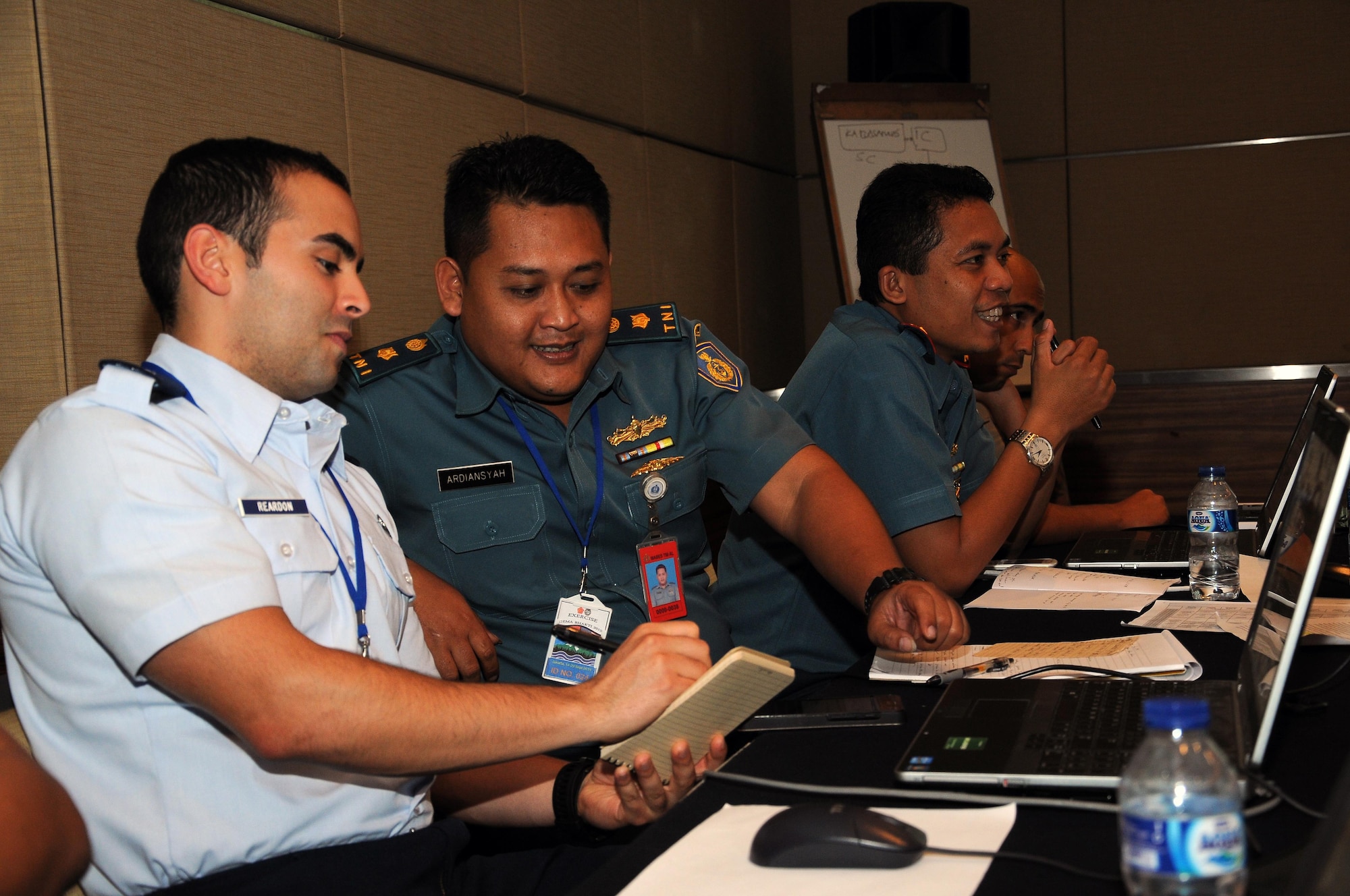 U.S. Air Force 1st Lt. Jeff Reardon, exercise logistics planner, and Tentara Nasional Indonesia Maj. Ardiansyah, logistics planner, discuss urban search and rescue considerations during exercise Gema Bhakti. Gema Bhakti, Indonesian for 'Echo of Good Deeds,' is a 10-day exercise designed to promote positive military relations, increase cultural awareness and enhance training and understanding of each other's capabilities. (U.S. Air Force photo by Capt. Joel Banjo-Johnson/Released)