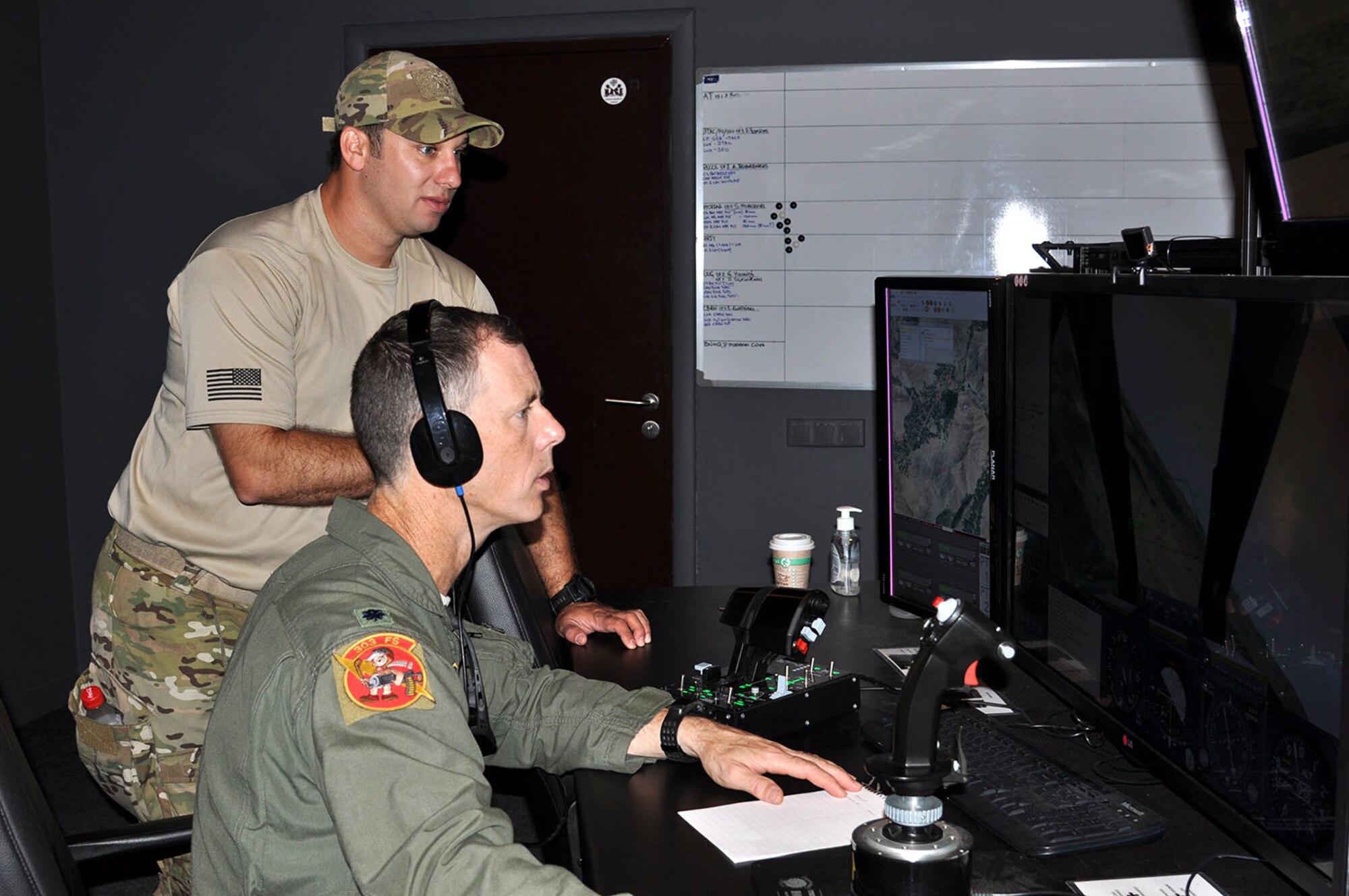 Lt. Col. John Marks, 303rd Fighter Squadron, Whiteman AFB, Missouri, trains with Air National Guard Joint Terminal Attack Controllers and Latvian military members in a simulator near Adazi Range in Latvia during a recent exercise. Marks received the Reserve Aircrew Award, the President’s Award. During 2014 Marks deployed in support of Operation Enduring Freedom. He led 124 combat missions, supporting 132 ground operations and 29 troops-in-contact situations without friendly or civilian casualty. By his tactical expertise and instruction, the squadron achieved a 99.7 percent weapons effectiveness rate.   (U.S. Air Force photo/Capt. Denise Haeussler)
