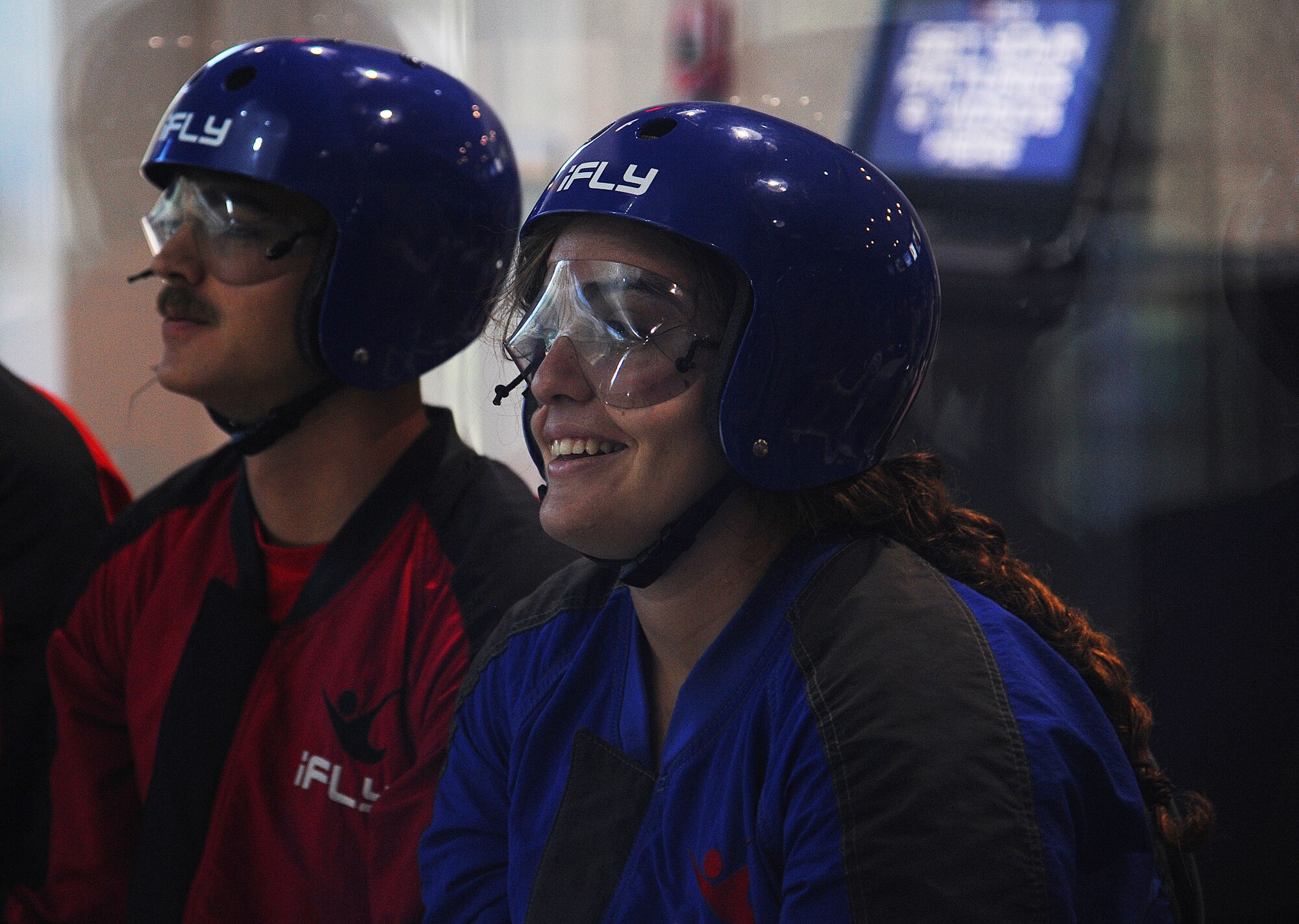 U.S. Air Force 2nd Lt. Amelia C. Beaton and Airman 1st Class Joel R. Steel, 315th Training Squadron students, wait for their turn inside the wind tunnel to experience simulated skydiving indoors at Austin, Texas, Sept. 19. The 17th Support Squadron at Goodfellow Air Force Base helps members on base have opportunities to experience fun events. (U.S. Air Force photo by Airman Caelynn Ferguson/Released)