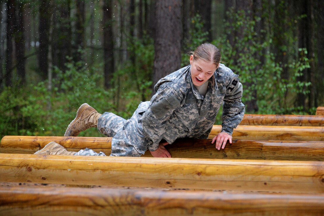 U.S. Army Spc. Julie Neff participates in the "team reaction lane" during the 2015 European Best Warrior Competition at the Grafenwoehr Training Area in Germany, Sept. 14, 2015. Neff is assigned to the 5th Battalion, 148th Aviation Regiment. U.S. Army photo by Gertrud Zach