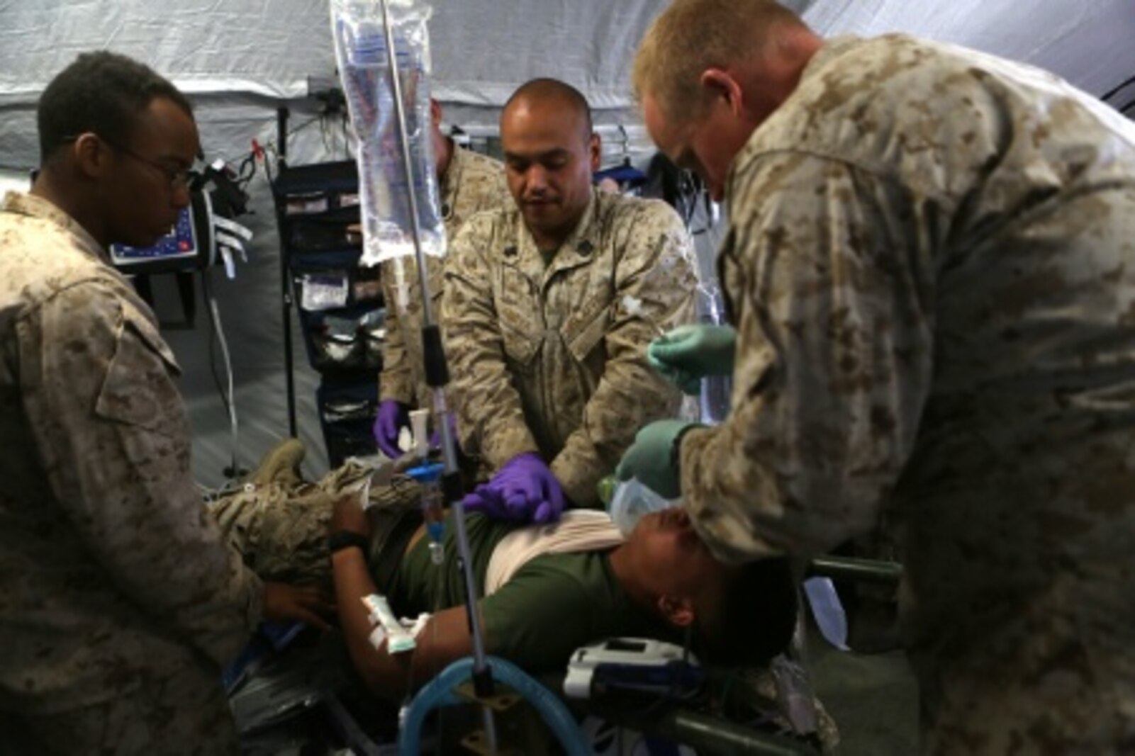 Sailors with Bravo Surgical Company, 1st Medical Battalion, 1st Marine Logistics Group, perform life-saving drills, displaying their medical expeditionary capabilities in support of Marines from 1st Battalion, 5th Marine Regiment, 1st Marine Division, during a mass casualty exercise aboard Camp Pendleton, Calif., Sept 8, 2015 as part of Dawn Blitz 2015.