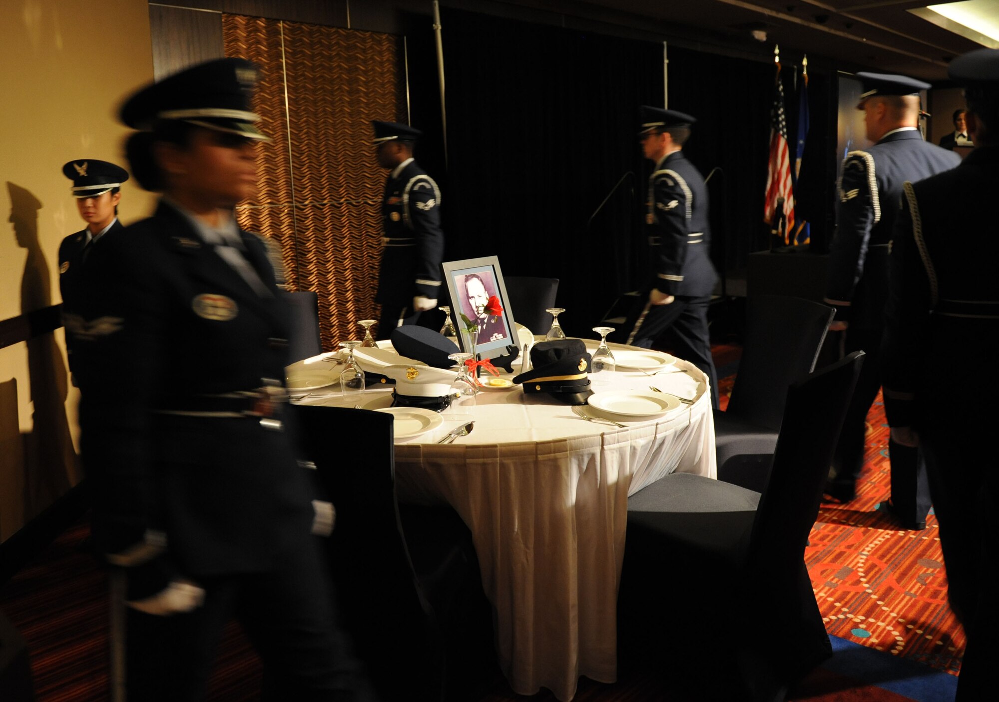 Members of the Keesler Air Force Base Honor Guard perform a POW/MIA table ceremony during the Keesler Air Force Ball on Sept. 19, 2015, at the Imperial Palace Casino, Biloxi, Miss. The event was sponsored by the Air Force Association John C. Stennis Chapter #332 to celebrate the Air Force’s 68th birthday. (U.S. Air Force photo by Kemberly Groue)