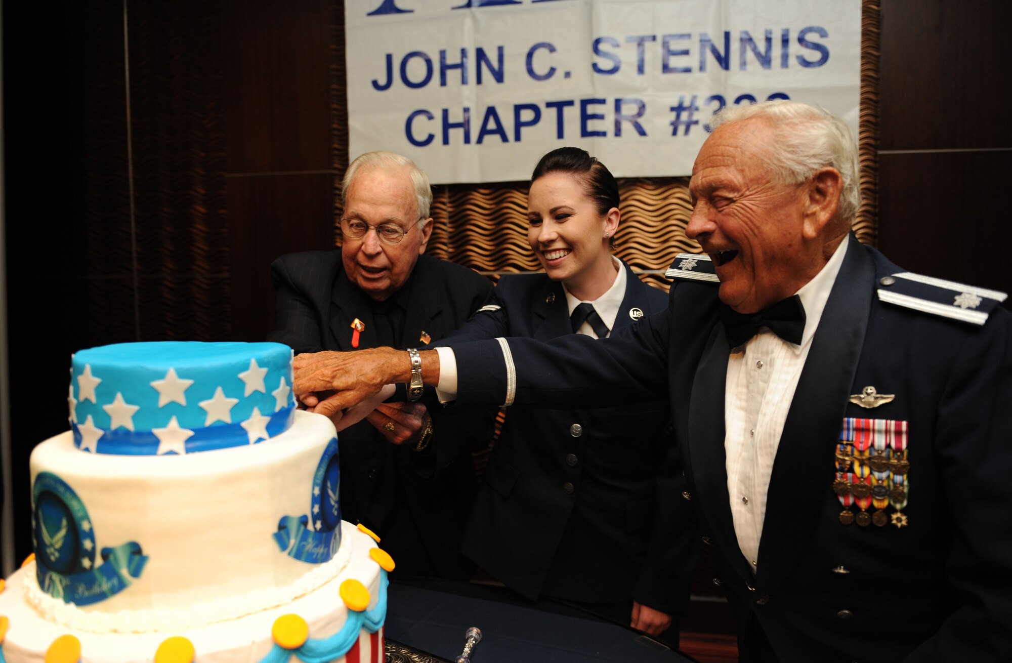 Retired Chief Master Sgt. Chuck Teston, Airman 1st Class Cheyenne Thomas, 334th Training Squadron student, and retired Lt. Col. Dick Wilson, cut a birthday cake during the Keesler Air Force Ball on Sept. 19, 2015, at the Imperial Palace Casino, Biloxi, Miss. Wilson was the oldest officer  at the ball while Teston was the oldest enlisted Airman, and Thomas was the youngest. The event was sponsored by the Air Force Association John C. Stennis Chapter #332 to celebrate the Air Force’s 68th birthday. (U.S. Air Force photo by Kemberly Groue)
