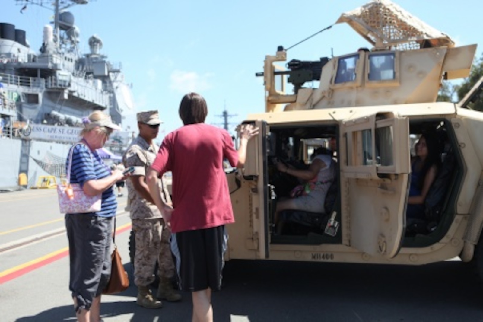Corporal Seysha Lek, a motor transportation operator with 7th Engineer Support Battalion, explains the Humvees capabilities to onlookers during San Diego Fleet Week 2015 aboard Naval Base Coronado, Calif., Sept. 20, 2015. Thirty-seven Marines from 7th ESB presented static displays during the event to demonstrate the quality of military assets to the citizens of San Diego.