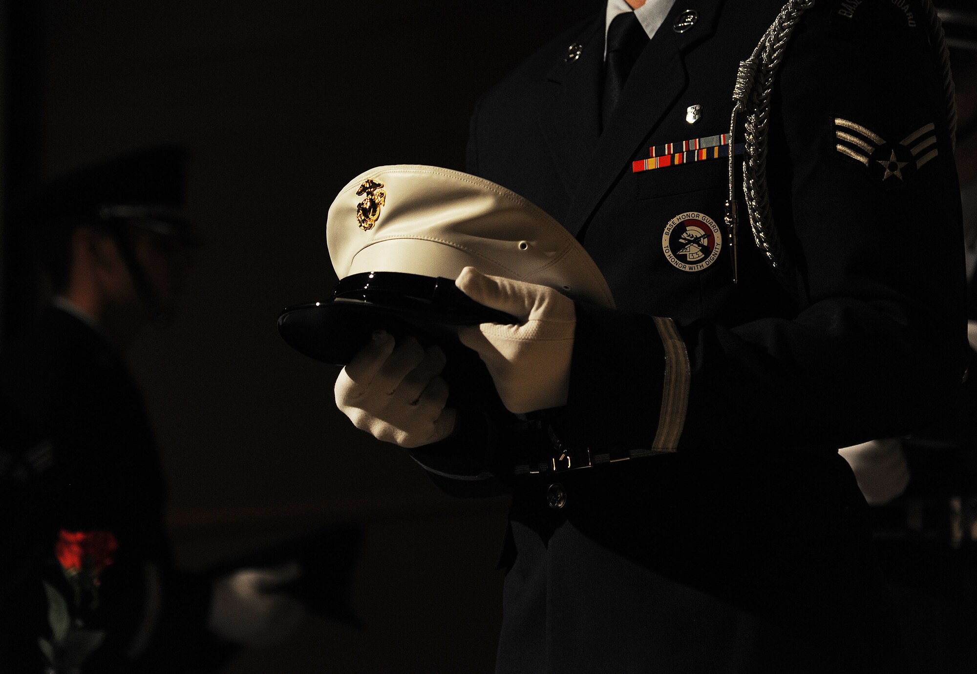 Goodfellow Air Force Base Honor Guard performs the Prisoners Of War/Missing In Action ceremony during the Air Force Ball at the McNease Convention Center in San Angelo, Texas, Sept. 18, 2015. During the ceremony, a wheel cap of each all U.S. military branches are carried and placed upon an empty dining table to recognize prisoners of war and those missing in action. (U.S. Air Force photo by Airman Caelynn Ferguson/Released)