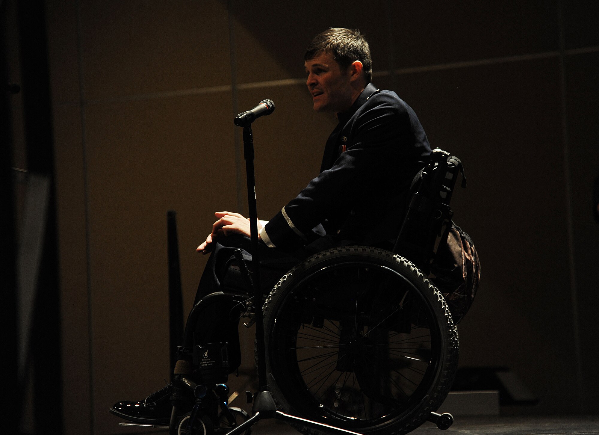 U.S. Air Force Capt. Nathan Nelson, 24th Special Operations Wing Special Tactics intelligence officer, gives a speech about his experiences after surviving a rocket blast in Afghanistan during the Goodfellow Air Force Ball at the McNease Convention Center in San Angelo, Texas, Sept. 18, 2015. Nelson goes on to explain his journey through rehabilitation and how Airmen should never stop giving their best no matter their circumstances. (U.S. Air Force photo by Airman Caelynn Ferguson/Released)