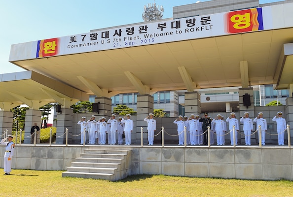 BUSAN, Republic of Korea (Sept. 21, 2015) - Vice Adm. Joseph Aucoin, the commander of U.S. Seventh Fleet, and Vice Adm. Um, Hyun-seong, the commander of the Republic of Korea Fleet (COMROKFLT), render salutes during a ceremonial pass and review of COMROKFLT sailors. 
