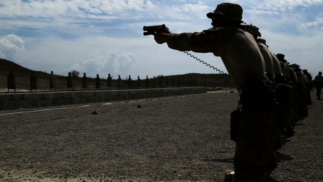 Marines with Company A, 1st Reconnaissance Battalion, 1st Marine Division, fire Colt M45 pistols during weapons familiarization training aboard Marine Corps Base Camp Pendleton, Calif., Sept. 9, 2015. The 2-week training schedule was used to build on basic infantry skills for an upcoming deployment with a Marine Expeditionary Unit. (U.S. Marine Corps photo by Cpl. Tony Simmons/RELEASED)
