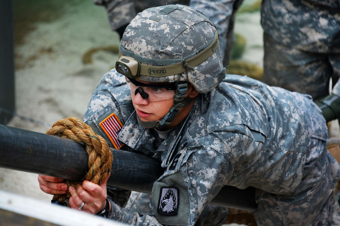 U.S. Army Spc. Julie Neff participates in the "team reaction lane" during the 2015 European Best Warrior Competition at the Grafenwoehr Training Area in Germany, Sept. 14, 2015. Neff is assigned to 5th Battalion, 148th Aviation Regiment. U.S. Army photo by Gertrud Zach