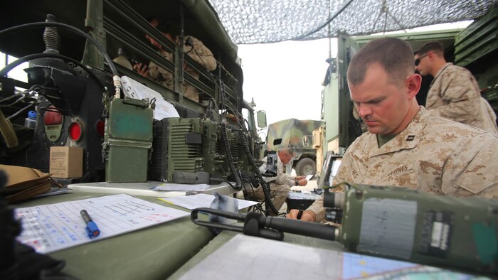Capt. Thomas Haynes, a fire direction officer with 1st Battalion, 10th Marine Regiment, is part of the fire support coordination center for the fire support training conducted on Camp Lejeune, N.C., Sept. 17, 2015. After the FST leaders decide what they would like to use as a killing asset, the call goes through the fire support coordination center for approval. 